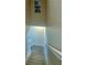 Bright stairway with beige carpet on the steps and light walls with a beach scene print at the top of the stairs at 3909 45Th W Ter # 102, Bradenton, FL 34210