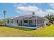 Beautiful backyard, pool, and screened-in patio perfect for outdoor relaxation at 4092 Green Tree Ave, Sarasota, FL 34233