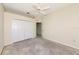 Clean bedroom with a ceiling fan, closet and ready for a new owner's style at 4092 Green Tree Ave, Sarasota, FL 34233