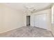 Bright bedroom features closet, door, ceiling fan, and space to make your own at 4092 Green Tree Ave, Sarasota, FL 34233