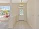 Bright entryway with tiled floor, decorative glass front door, and large window at 4092 Green Tree Ave, Sarasota, FL 34233