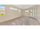 Spacious living room with a view of the yard and abundant natural light at 4092 Green Tree Ave, Sarasota, FL 34233