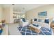 Stylish living room featuring modern furniture and decor with a view into the kitchen at 4092 Green Tree Ave, Sarasota, FL 34233