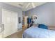 Bedroom with white closet doors and gray carpet at 4513 Abacos Pl, Bradenton, FL 34203