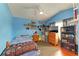 Brightly colored bedroom with a ceiling fan, wood flooring, and ample natural light at 4513 Abacos Pl, Bradenton, FL 34203