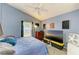 Bedroom with vaulted ceiling, fan, dresser, and view of the window at 4513 Abacos Pl, Bradenton, FL 34203