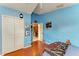 This bedroom offers bright walls, wood flooring, and a closet with a double door at 4513 Abacos Pl, Bradenton, FL 34203