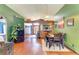 Open concept dining area features wood floors and access to the kitchen at 4513 Abacos Pl, Bradenton, FL 34203