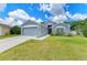 Charming single-story home with a well-maintained lawn, two-car garage, and beautiful landscaping at 4513 Abacos Pl, Bradenton, FL 34203
