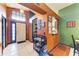 Spacious foyer featuring tile flooring, high ceilings, and a glimpse into the dining and kitchen areas at 4513 Abacos Pl, Bradenton, FL 34203