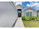Welcoming entryway with a decorative wreath, manicured landscaping, and attractive front facade at 4513 Abacos Pl, Bradenton, FL 34203