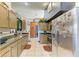 Bright kitchen featuring stainless steel appliances and generous cabinet space at 4513 Abacos Pl, Bradenton, FL 34203
