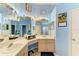 This bright bathroom boasts double sinks, a large mirror, and ample vanity space at 4513 Abacos Pl, Bradenton, FL 34203