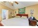 Spacious bedroom with a ceiling fan and an ensuite bathroom at 4513 Abacos Pl, Bradenton, FL 34203