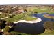 Golf course view of mature landscape with water features at 4691 Las Brisas Ln, Sarasota, FL 34238