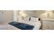 Cozy bedroom with neutral walls, white dressers, and a comfortable bed at 4691 Las Brisas Ln, Sarasota, FL 34238