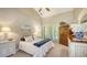 Bedroom featuring vaulted ceiling, shutters, and classic furnishings at 4691 Las Brisas Ln, Sarasota, FL 34238