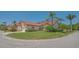 Charming villa with a tile roof, paver driveway and mature landscaping at 4691 Las Brisas Ln, Sarasota, FL 34238