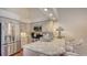 Well-lit kitchen with stainless steel appliances, granite countertops, and bar seating at 4691 Las Brisas Ln, Sarasota, FL 34238