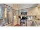 Kitchen featuring stainless steel appliances, granite countertops, and tile backsplash at 4691 Las Brisas Ln, Sarasota, FL 34238