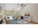 Bright living room with vaulted ceilings, ceiling fan, arched windows and fireplace at 4691 Las Brisas Ln, Sarasota, FL 34238