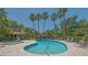 Community pool area with a separate spa and plenty of seating for lounging at 4691 Las Brisas Ln, Sarasota, FL 34238