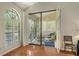 Inviting sun room with tile flooring, a ceiling fan, and access to the outdoors at 4691 Las Brisas Ln, Sarasota, FL 34238