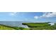 Expansive aerial view of the bay and surrounding lush mangroves, highlighting the coastal charm at 4800 Gulf Of Mexico Dr # 205, Longboat Key, FL 34228