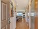 Inviting foyer featuring an entry door, view of the hall, ocean view, and a glimpse of the coastal living space at 4800 Gulf Of Mexico Dr # 205, Longboat Key, FL 34228