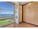Interior corner featuring built-in storage and large windows overlooking scenic views at 4800 Gulf Of Mexico Dr # 205, Longboat Key, FL 34228