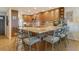 Spacious eat-in kitchen features wood cabinets, granite counters, stainless steel appliances, and breakfast bar seating at 4800 Gulf Of Mexico Dr # 205, Longboat Key, FL 34228