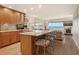 Well appointed kitchen that opens to the living area with quartz counters and seating at the breakfast bar at 4800 Gulf Of Mexico Dr # 205, Longboat Key, FL 34228