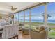 Comfortable living area with large windows offering scenic water views and plenty of natural light at 4800 Gulf Of Mexico Dr # 205, Longboat Key, FL 34228