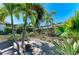Professionally landscaped backyard with custom stone accents at 4908 Tivoli Run, Bradenton, FL 34211