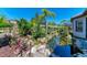 Beautiful backyard pond with mature landscaping and a serene atmosphere at 4908 Tivoli Run, Bradenton, FL 34211