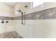 Modern bathroom boasting a rainfall shower head, decorative tile, and sleek fixtures at 4908 Tivoli Run, Bradenton, FL 34211