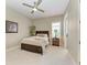 Bright bedroom featuring natural light from the window, a ceiling fan, and modern flooring at 4908 Tivoli Run, Bradenton, FL 34211