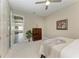 Relaxing bedroom featuring natural light, modern flooring, and a stylish wood dresser at 4908 Tivoli Run, Bradenton, FL 34211