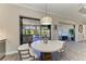 Cozy breakfast nook leading to an outdoor living area with a spa, grill, and outdoor seating at 4908 Tivoli Run, Bradenton, FL 34211