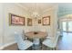 Charming dining area featuring a round table, modern chairs, and an elegant chandelier at 4908 Tivoli Run, Bradenton, FL 34211