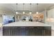 Bright kitchen with a large island and modern pendant lighting at 4908 Tivoli Run, Bradenton, FL 34211