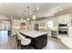 Gourmet kitchen with stainless steel appliances, custom cabinetry, and a large island at 4908 Tivoli Run, Bradenton, FL 34211