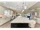 Open kitchen with a large island, modern appliances, and lots of natural light at 4908 Tivoli Run, Bradenton, FL 34211
