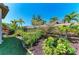 Beautifully landscaped yard with a variety of plants, trees, and manicured lawn at 4908 Tivoli Run, Bradenton, FL 34211