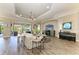 Comfortable living room with wood floors, a ceiling fan, and a TV at 4908 Tivoli Run, Bradenton, FL 34211