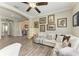 Cozy living room featuring a comfortable sofa with decorative pillows and an open-concept design at 4908 Tivoli Run, Bradenton, FL 34211