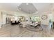 Spacious living room with wood floors, recessed lighting, and an open layout at 4908 Tivoli Run, Bradenton, FL 34211