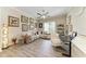 Inviting living room with a large sectional sofa, stylish decor, and a contemporary ceiling fan at 4908 Tivoli Run, Bradenton, FL 34211