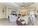 Bright living room featuring wood-style flooring, comfortable seating, and natural light at 4908 Tivoli Run, Bradenton, FL 34211