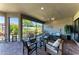 Relaxing outdoor patio with comfortable seating and views of the backyard pond at 4908 Tivoli Run, Bradenton, FL 34211